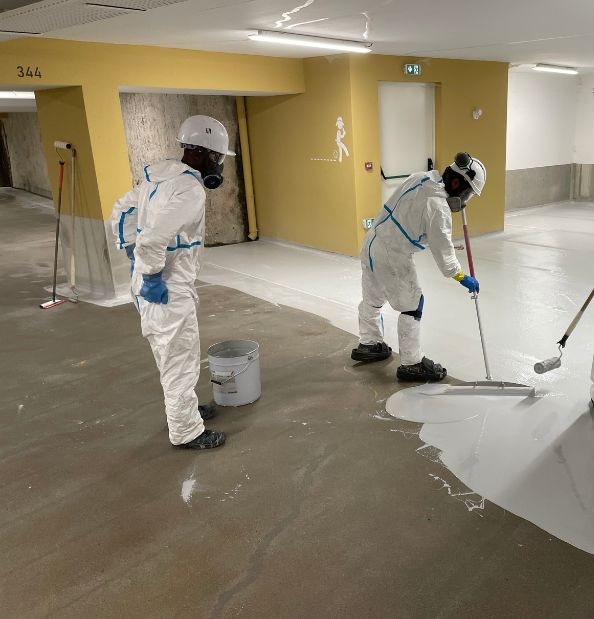 Application d'un système de protection sur dalle béton